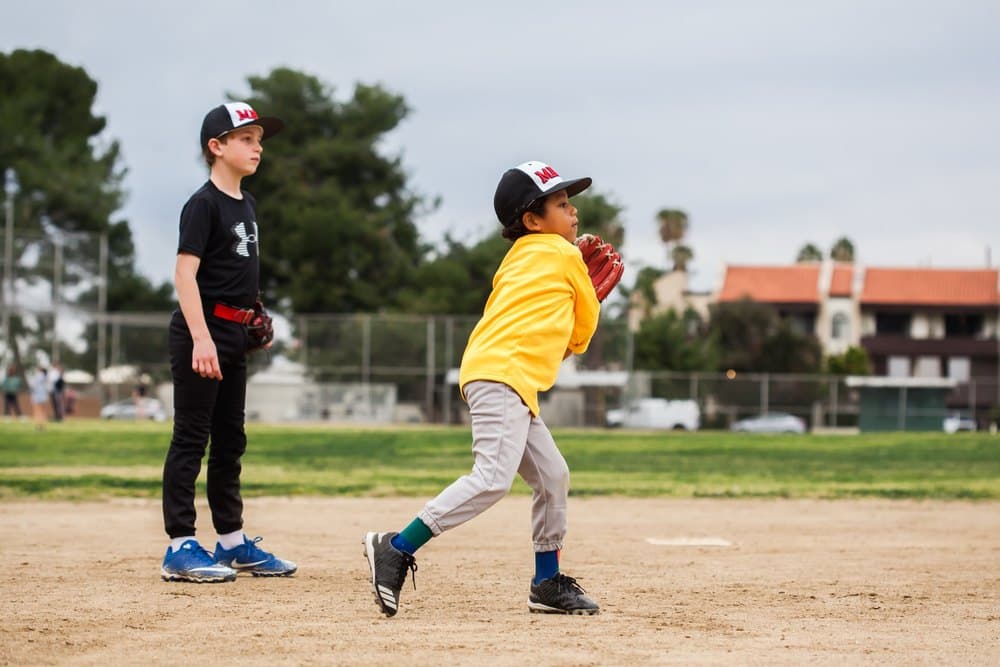 A young player throwing during a lesson