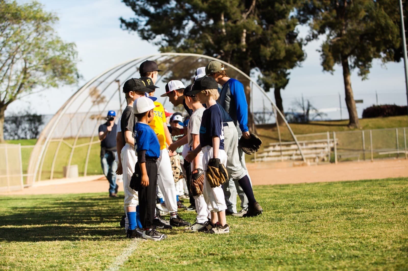 A youth baseball camp at golden hour