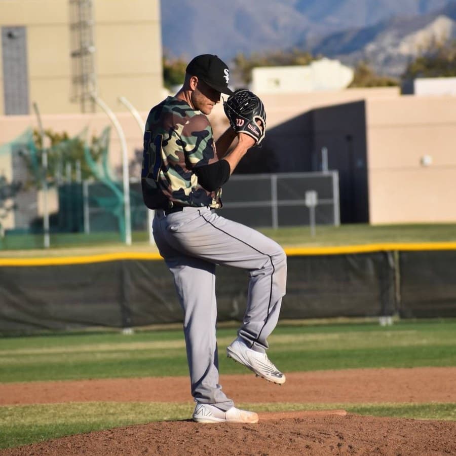An adult league pitcher at the top of his delivery