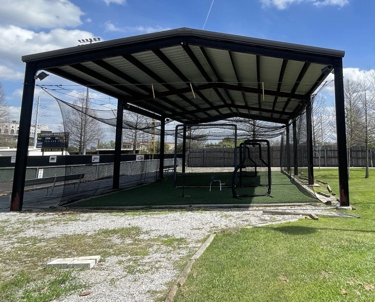 An empty covered outdoor batting cage