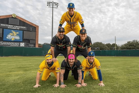 Banana Ball and Party Animals players posing on the field at Historic Grayson Stadium