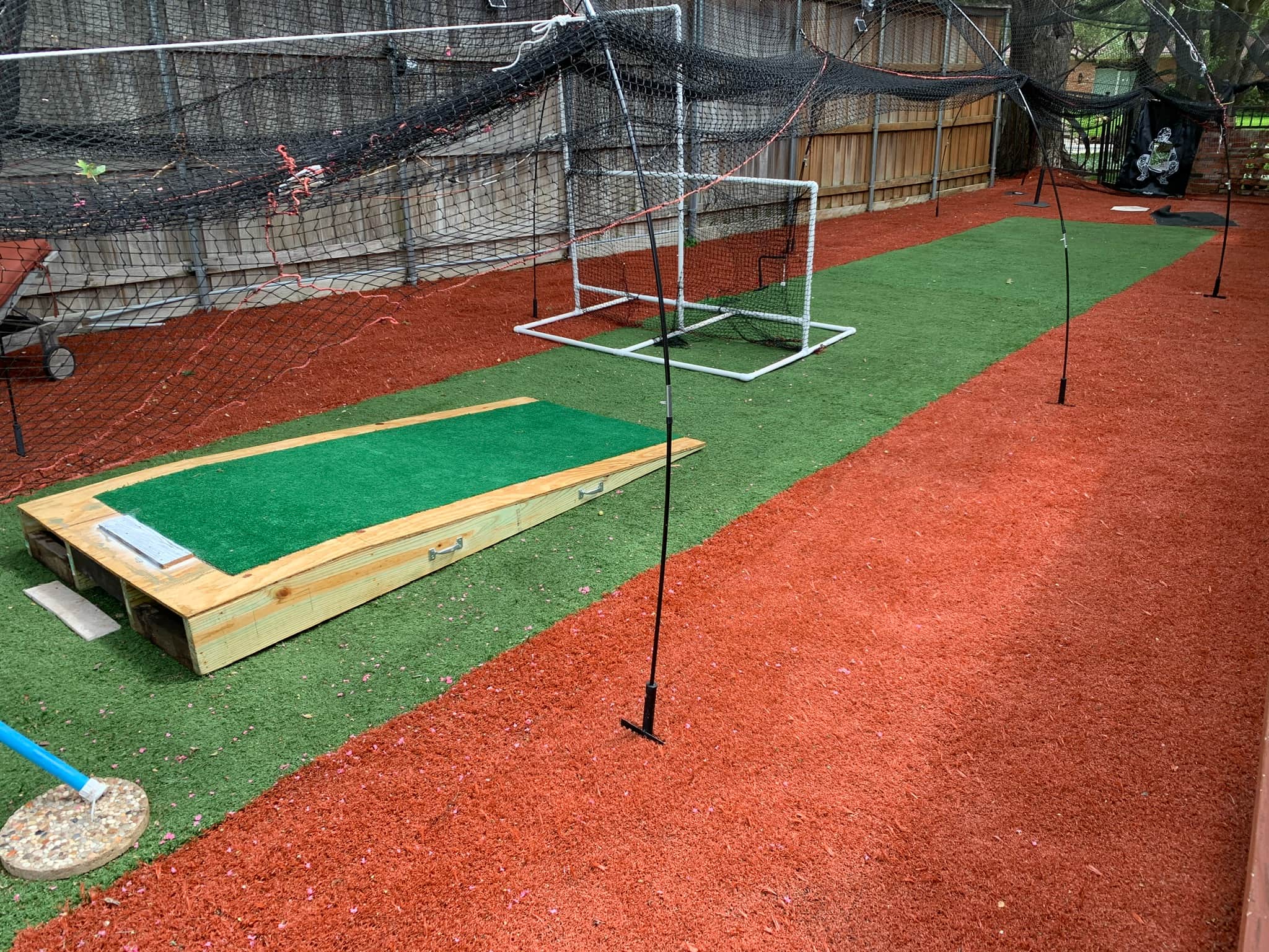 Batting cage with pitching machine and mound. Approx in Dallas, TX photo 2