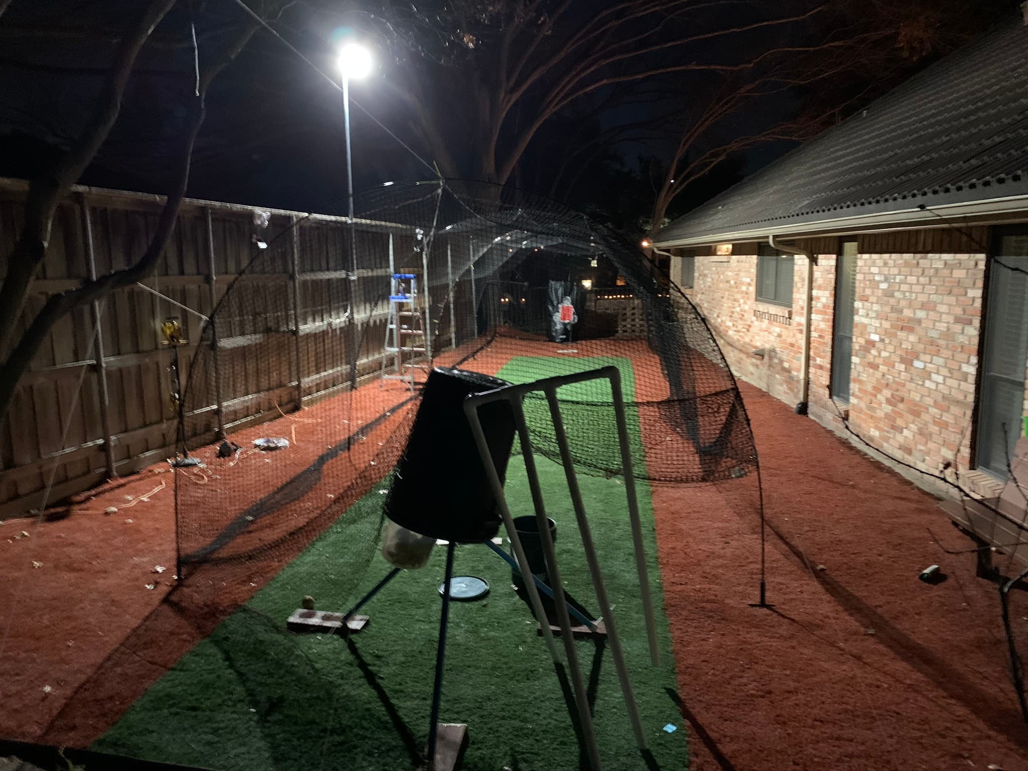 Batting cage with pitching machine and mound. Approx in Dallas, TX - Batting cage rental in Dallas, TX