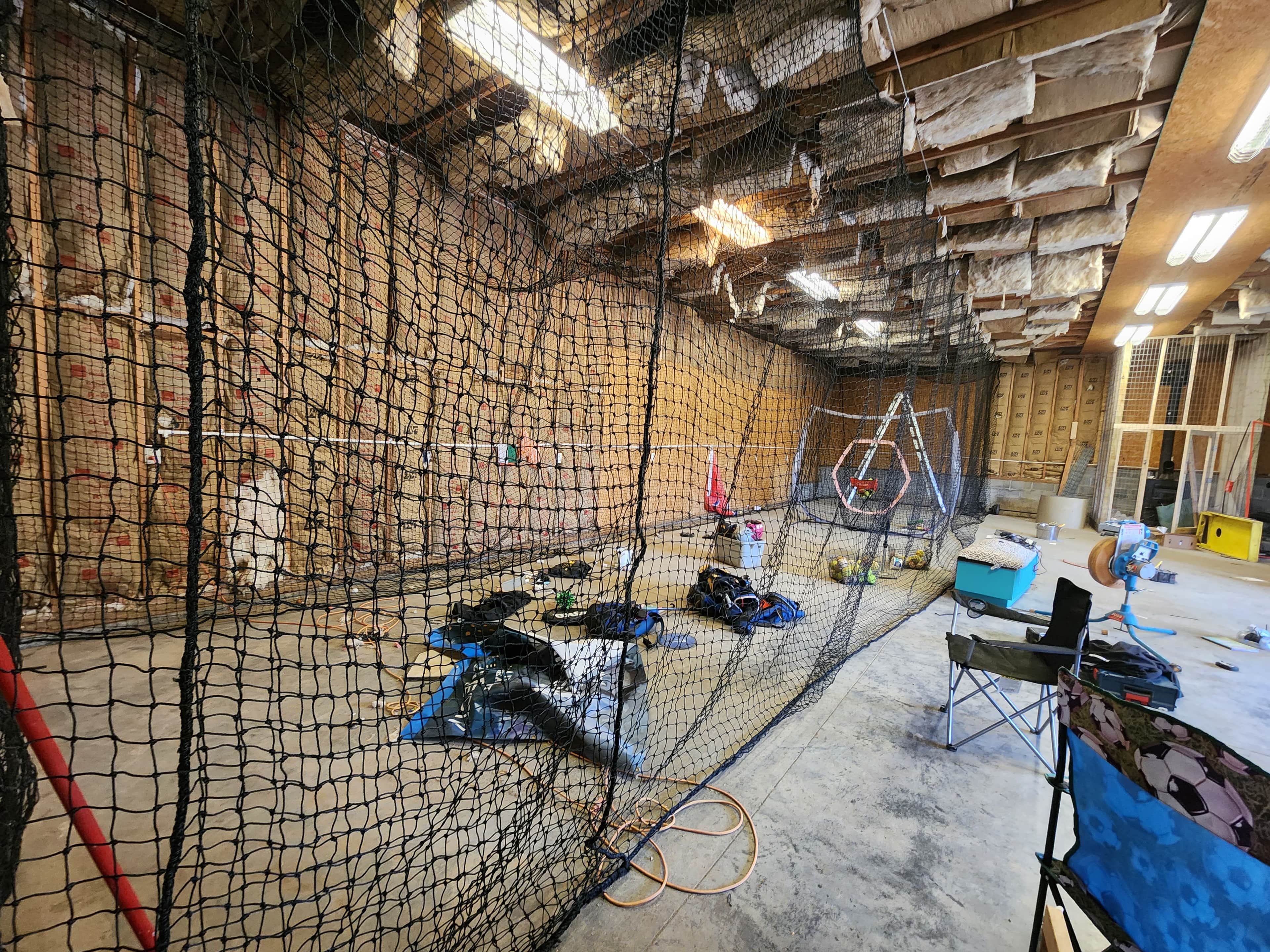 Indoor Batting Cage! Softball pitching machine and bathroom access in