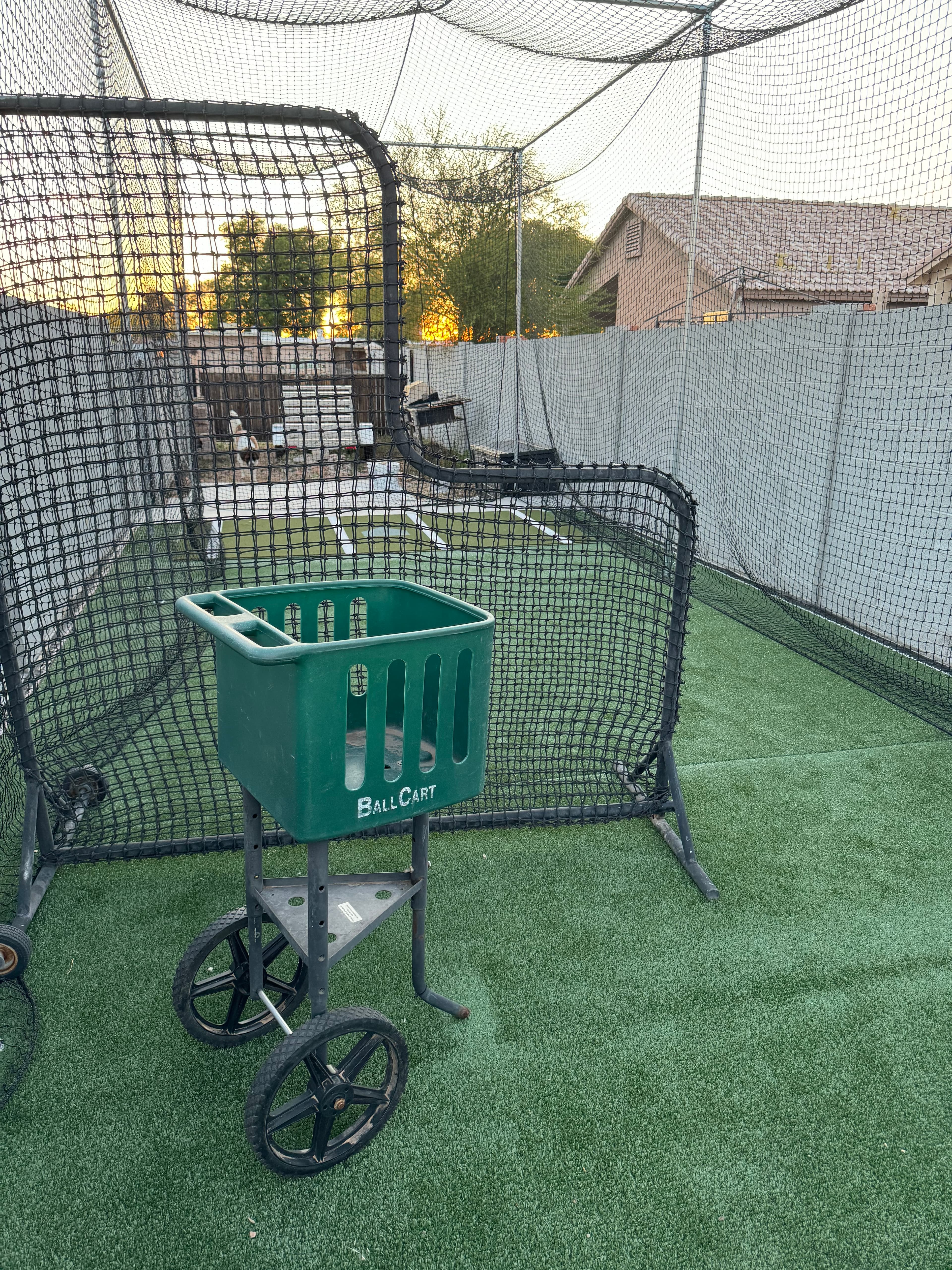 L screen and bucket of balls with tee hitting in Phoenix, AZ - Batting cage rental in Phoenix, AZ