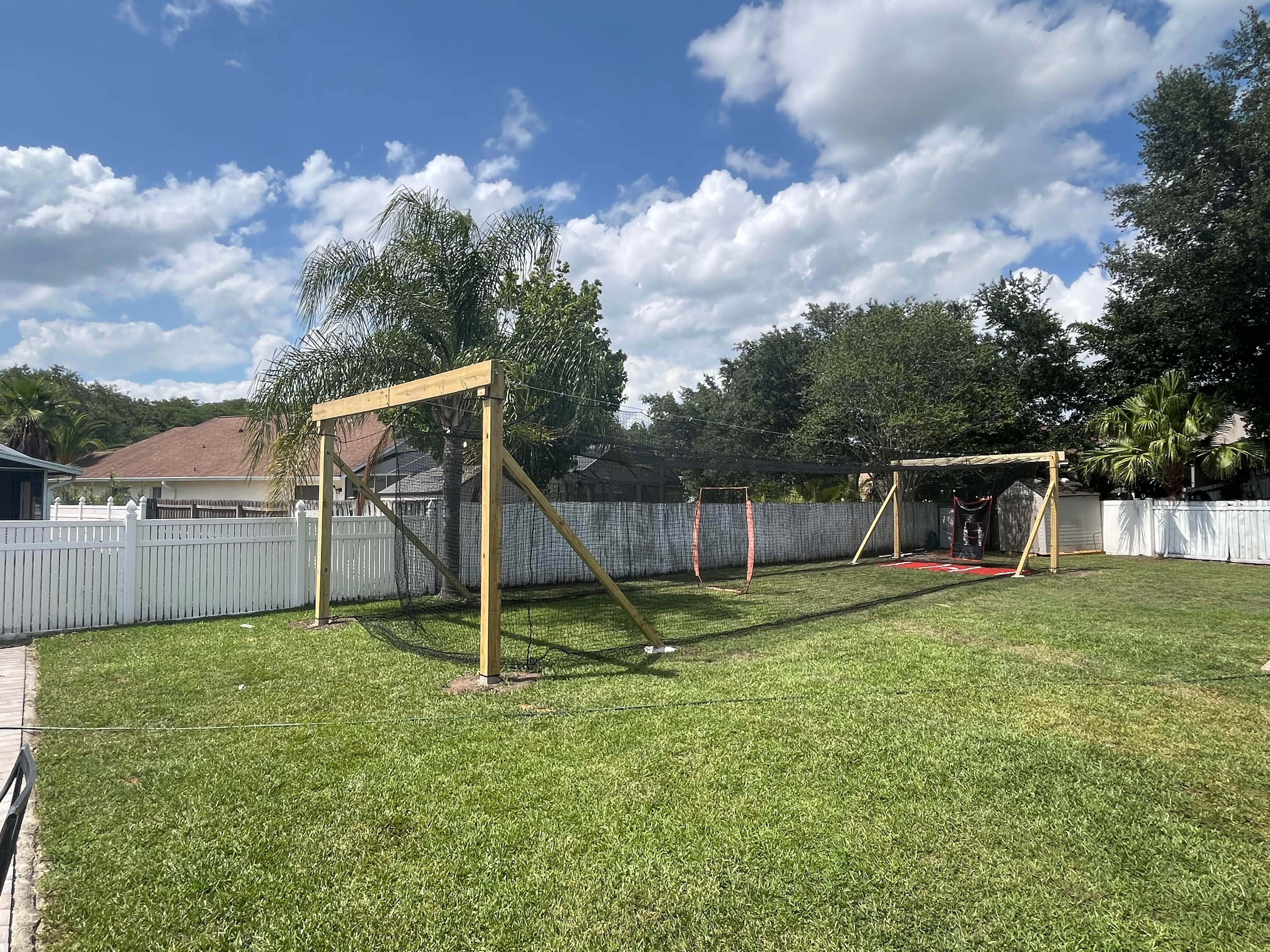 Outdoor Batting Cage in Orlando, FL — Pitching Machine & Baseball