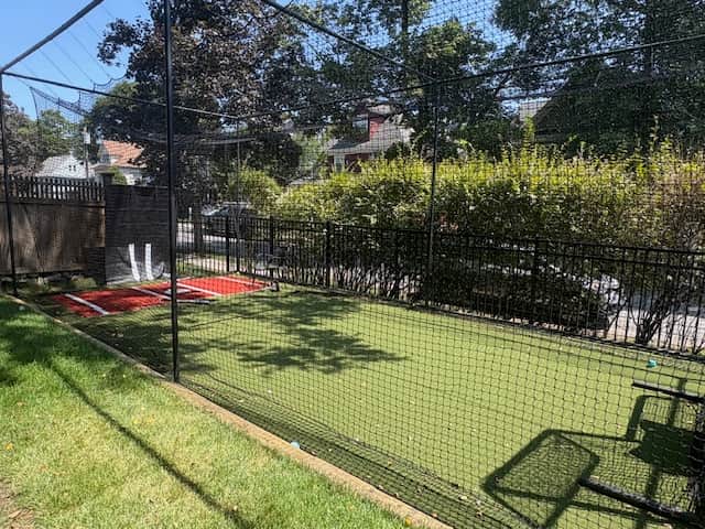 Turf batting cage with feeder in Winchester MA