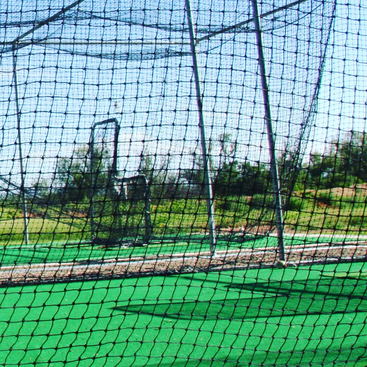 HitTrax training bay in a batting cage facility