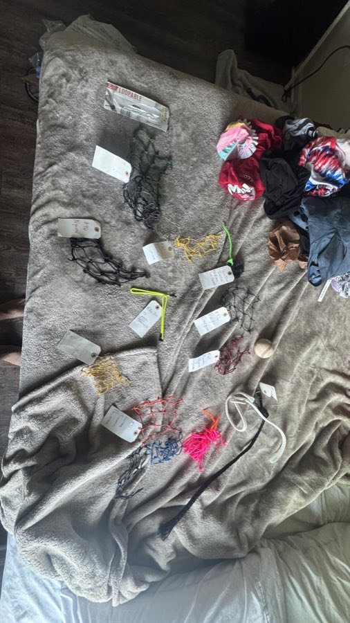 A kit of tagged batting cage netting samples in multiple grades and colors